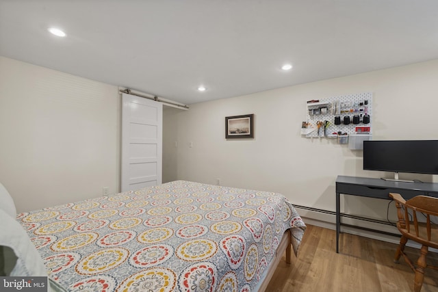3301 Beech Ave, Baltimore, MD 21211 - bedroom featuring wood finished floors, a baseboard heating unit, and recessed lighting