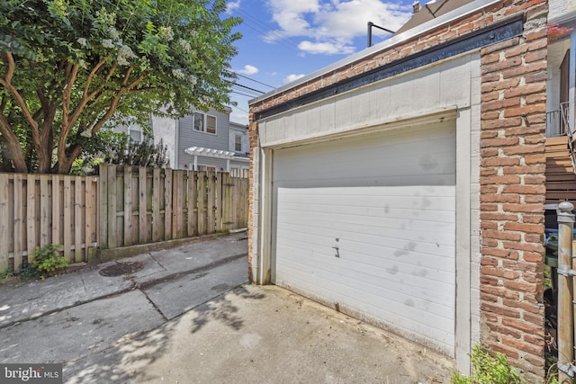 3301 Beech Ave, Baltimore, MD 21211 - garage featuring concrete driveway