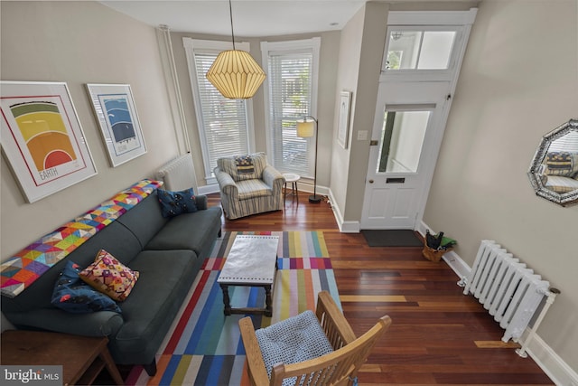 3301 Beech Ave, Baltimore, MD 21211 - living area with radiator heating unit and wood finished floors