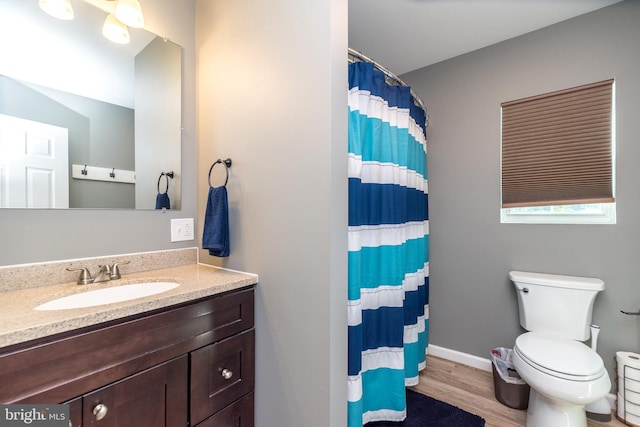 883 N Hanover St, Pottstown, PA 19464 - full bath featuring vanity, wood finished floors, and a shower with curtain