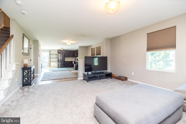 883 N Hanover St, Pottstown, PA 19464 - living room with stairway and light carpet