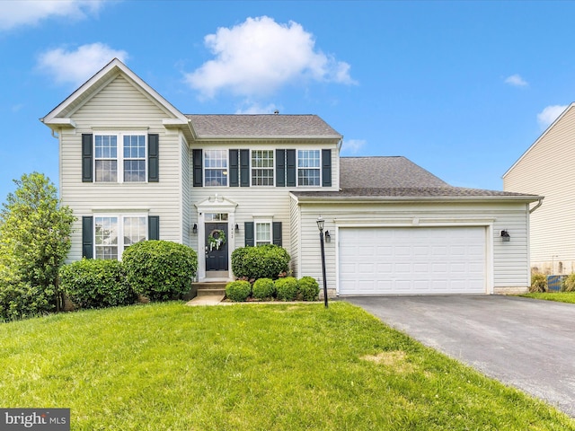 1402 Marian Way, Mount Airy, MD 21771 - view of front of property with asphalt driveway, a front yard, a garage, and roof with shingles