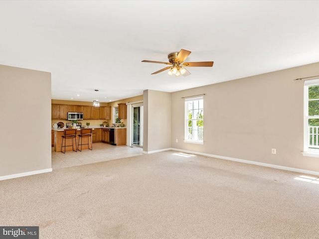1402 Marian Way, Mount Airy, MD 21771 - unfurnished living room featuring light colored carpet and ceiling fan