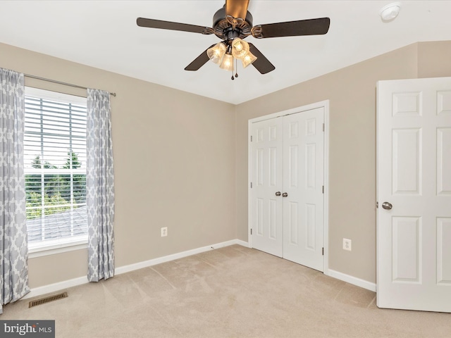1402 Marian Way, Mount Airy, MD 21771 - unfurnished bedroom featuring light colored carpet, a closet, and a ceiling fan