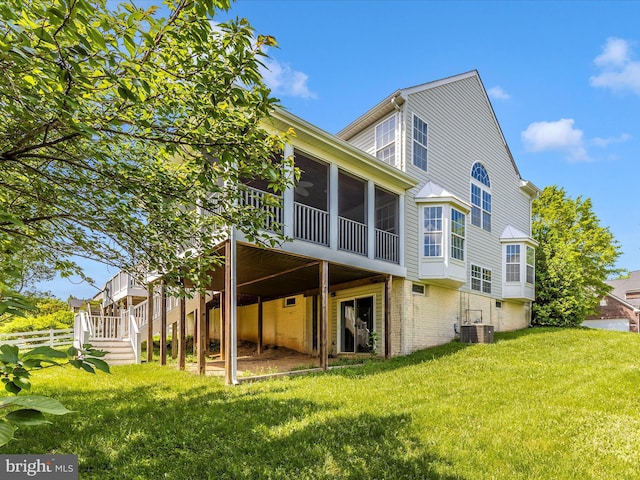1402 Marian Way, Mount Airy, MD 21771 - back of house with a sunroom, a lawn, and brick siding