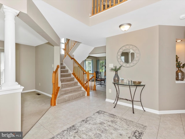 1402 Marian Way, Mount Airy, MD 21771 - foyer with decorative columns, tile patterned flooring, and stairs