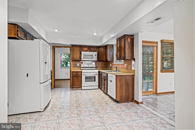 63 Lakeside Dr, Marlton, NJ 08053 - kitchen featuring white appliances, light countertops, recessed lighting, backsplash, and light tile patterned floors