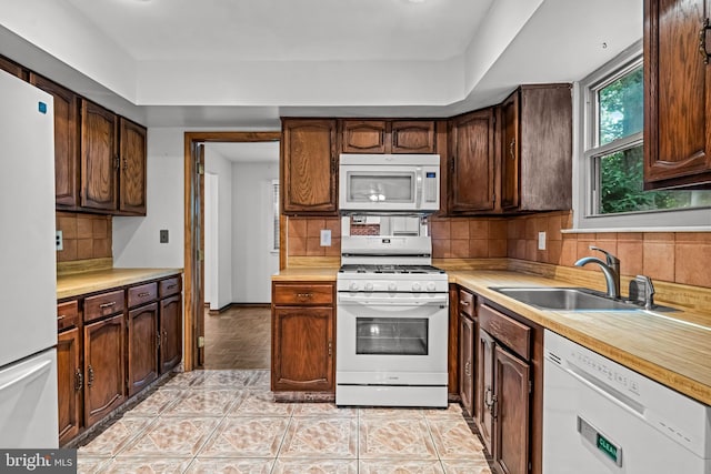 63 Lakeside Dr, Marlton, NJ 08053 - kitchen featuring white appliances, light countertops, tasteful backsplash, and light tile patterned flooring