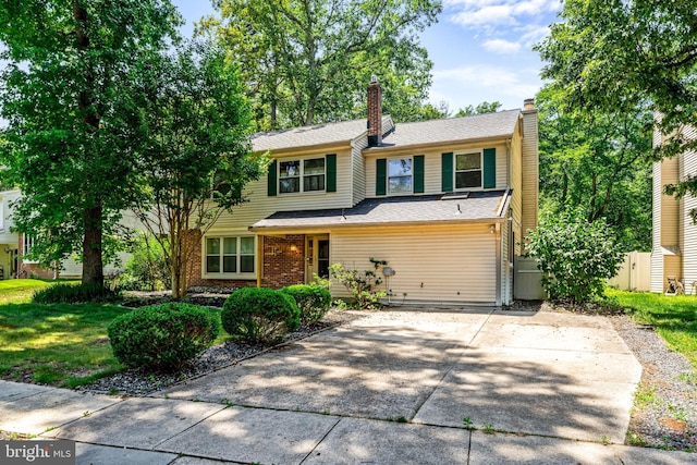 63 Lakeside Dr, Marlton, NJ 08053 - view of front of property with a chimney, concrete driveway, and brick siding