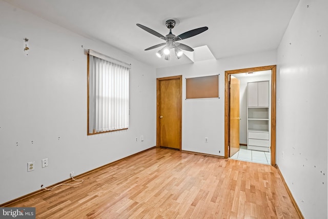 63 Lakeside Dr, Marlton, NJ 08053 - unfurnished bedroom featuring light wood-style floors, a closet, and a ceiling fan