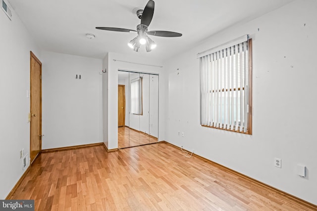 63 Lakeside Dr, Marlton, NJ 08053 - unfurnished bedroom with wood finished floors, a closet, and a ceiling fan