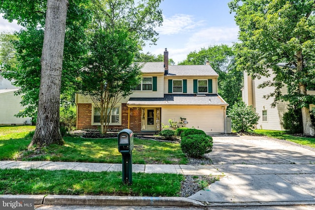 63 Lakeside Dr, Marlton, NJ 08053 - view of front of home featuring concrete driveway, a front lawn, brick siding, and a chimney