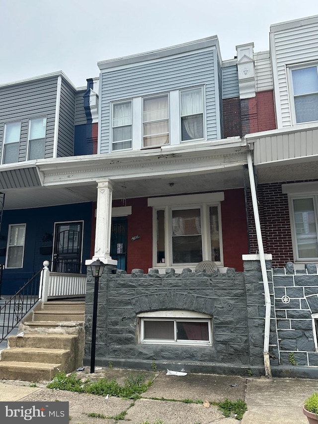 5816 Delancey St, Philadelphia, PA 19143 - view of front of property with a porch and brick siding