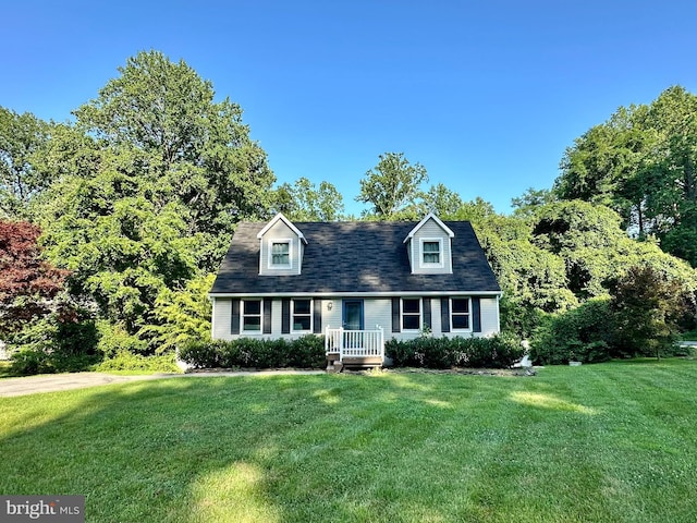 8970 Saint Andrews Dr, Chesapeake Beach, MD 20732 - cape cod home featuring a front lawn