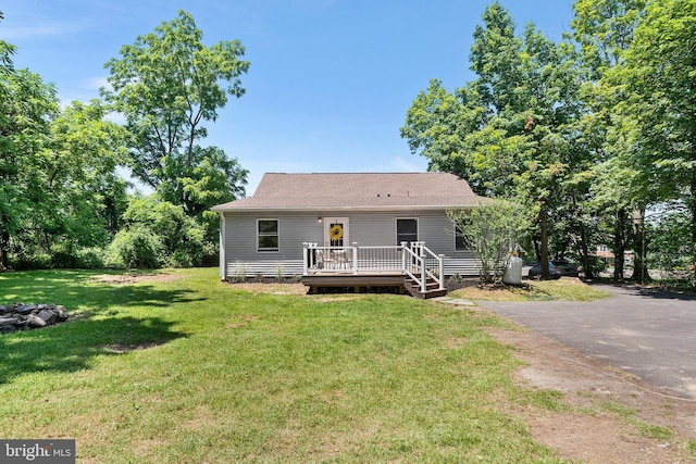 3409 Old York Rd, Furlong, PA 18925 - view of front of property with a deck, a front yard, and a shingled roof