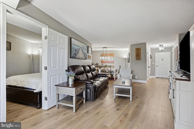 5904 Mount Eagle Dr Unit 1003, Alexandria, VA 22303 - living room with a textured ceiling and light wood-style floors