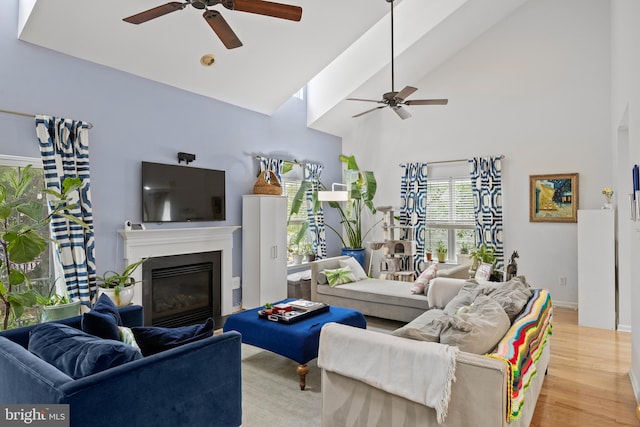 10 Crump Ln, Merchantville, NJ 08109 - living room featuring ceiling fan, light wood-style flooring, high vaulted ceiling, and a glass covered fireplace