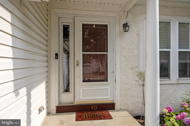 10 Crump Ln, Merchantville, NJ 08109 - doorway to property featuring stucco siding