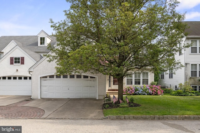 10 Crump Ln, Merchantville, NJ 08109 - view of front facade with concrete driveway, a front yard, and stucco siding
