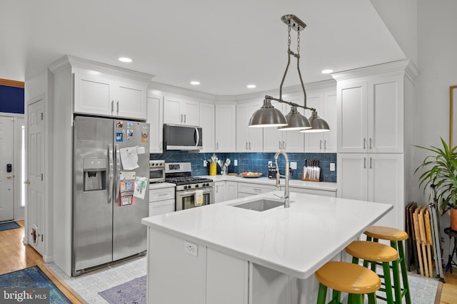 10 Crump Ln, Merchantville, NJ 08109 - kitchen with stainless steel appliances, backsplash, white cabinetry, hanging light fixtures, and recessed lighting