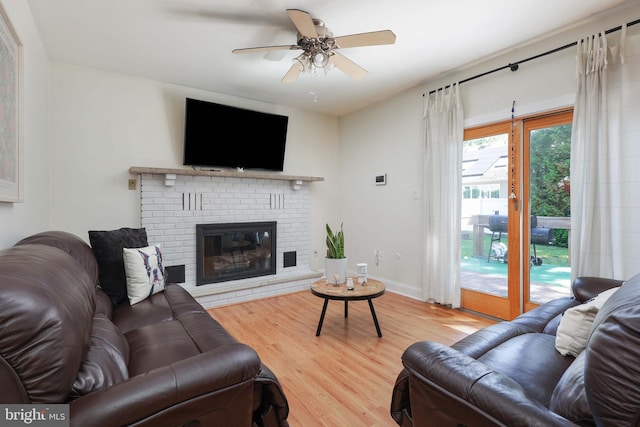 1618 Whitcomb Rd, Forked River, NJ 08731 - living room featuring wood finished floors, ceiling fan, and a fireplace
