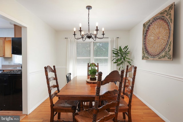 1618 Whitcomb Rd, Forked River, NJ 08731 - dining room with a chandelier, plenty of natural light, and light wood-style floors