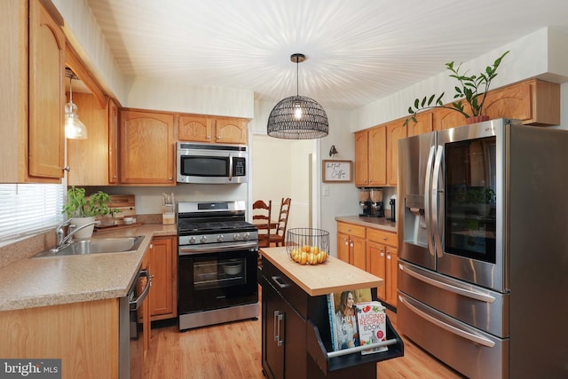 1618 Whitcomb Rd, Forked River, NJ 08731 - kitchen featuring appliances with stainless steel finishes, light wood-style flooring, and pendant lighting
