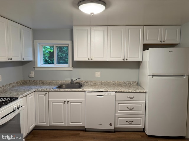 1505 London Ave, Wilmington, DE 19808 - kitchen featuring white appliances, dark wood-type flooring, white cabinets, and light countertops