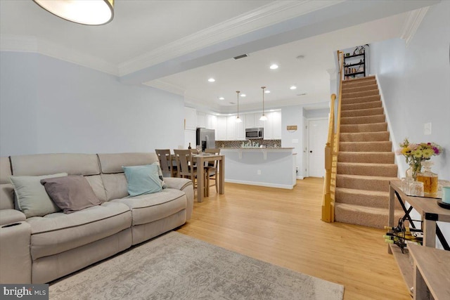 5707 Callcott Way Unit G, Alexandria, VA 22312 - living area featuring light wood-type flooring, stairs, crown molding, and recessed lighting