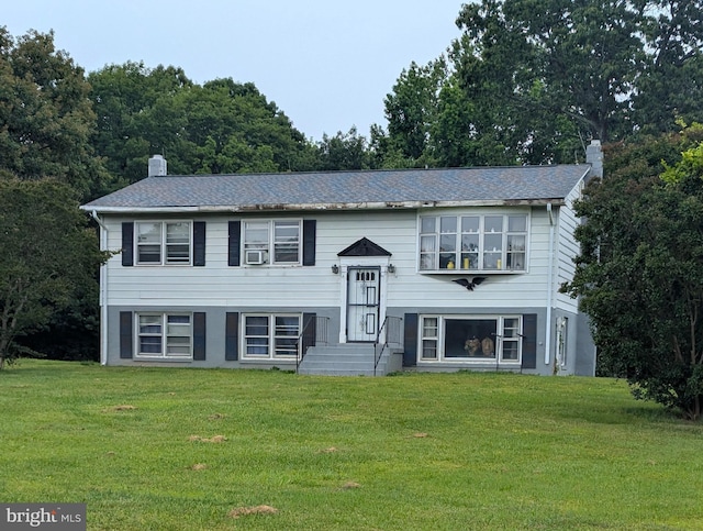13020 Martin Rd, Brandywine, MD 20613 - split foyer home with a chimney, a front lawn, and cooling unit