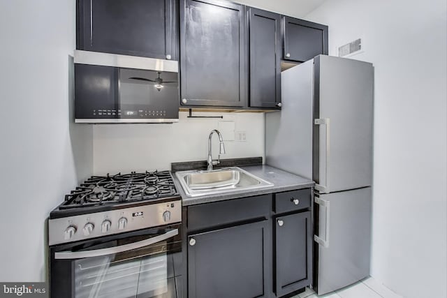 1 Scott Cir NW Unit 305, Washington, DC 20036 - kitchen featuring gas range, freestanding refrigerator, and light tile patterned floors