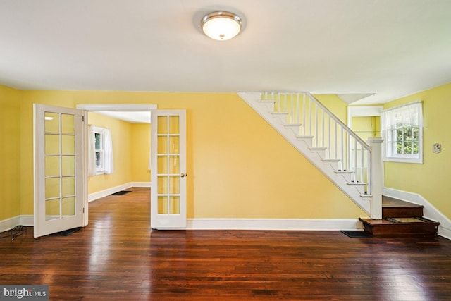 28 Oriole Ave, Media, PA 19063 - unfurnished living room with hardwood / wood-style flooring, stairs, and french doors