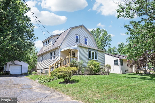 28 Oriole Ave, Media, PA 19063 - dutch colonial with an outbuilding, a detached garage, driveway, a front yard, and a gambrel roof