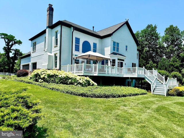 401 Walker Rd, Great Falls, VA 22066 - back of property with a chimney, a lawn, and a wooden deck
