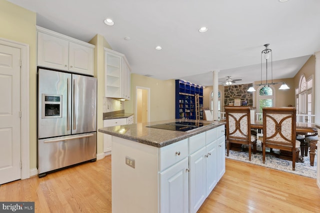 10009 Thompson Ridge Ct, Great Falls, VA 22066 - kitchen featuring stainless steel fridge with ice dispenser, black electric stovetop, ceiling fan, white cabinetry, and a center island