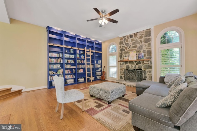 10009 Thompson Ridge Ct, Great Falls, VA 22066 - living room with a ceiling fan, wood finished floors, and a fireplace