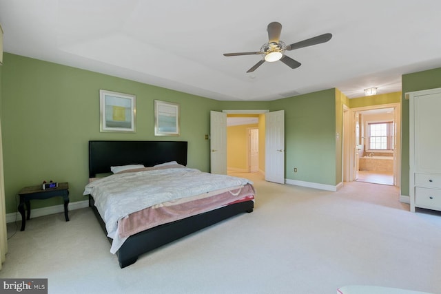 10009 Thompson Ridge Ct, Great Falls, VA 22066 - bedroom featuring light colored carpet, ensuite bathroom, and a ceiling fan