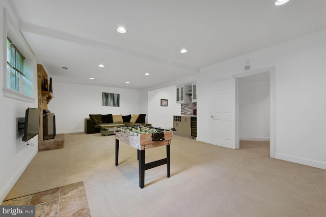 10009 Thompson Ridge Ct, Great Falls, VA 22066 - playroom featuring light colored carpet, beverage cooler, a fireplace, recessed lighting, and bar area