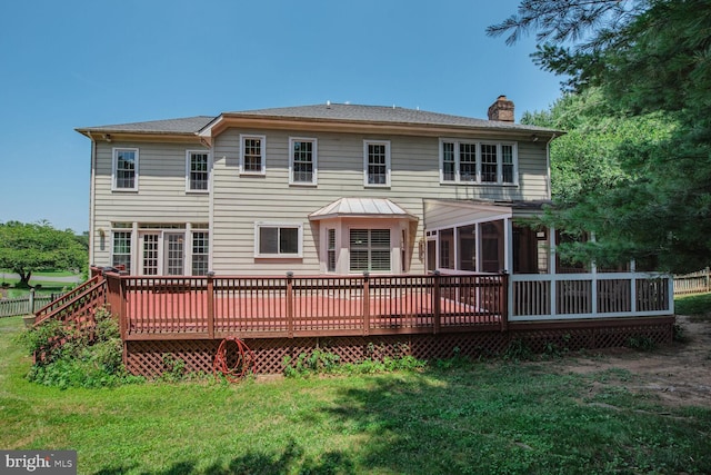 10009 Thompson Ridge Ct, Great Falls, VA 22066 - rear view of house featuring a chimney, a sunroom, a yard, and a deck