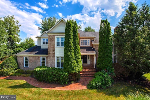 10009 Thompson Ridge Ct, Great Falls, VA 22066 - view of front of house with brick siding and a front yard