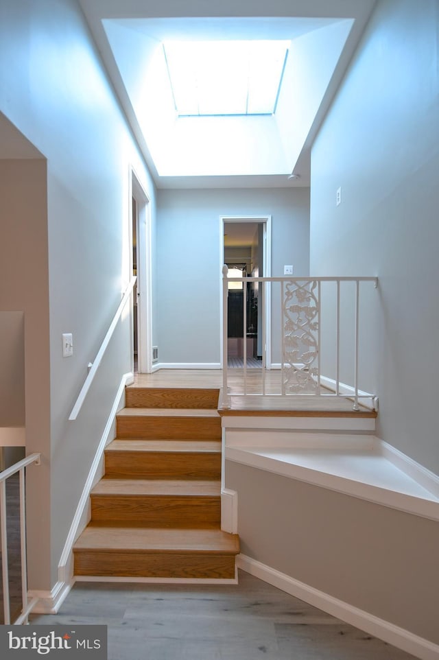 2016 Cascade Rd, Silver Spring, MD 20902 - staircase with a skylight and wood finished floors