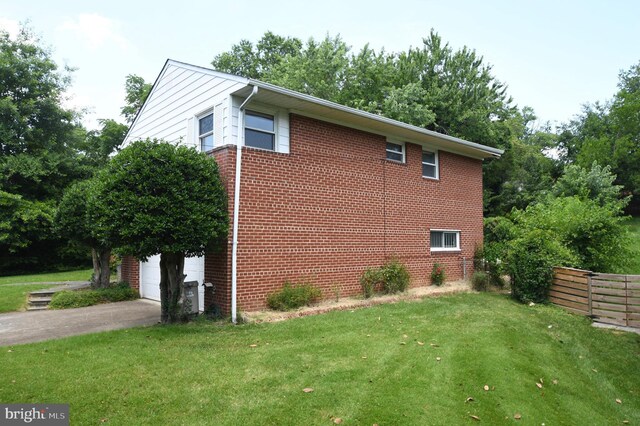 2016 Cascade Rd, Silver Spring, MD 20902 - view of side of property with a garage and brick siding