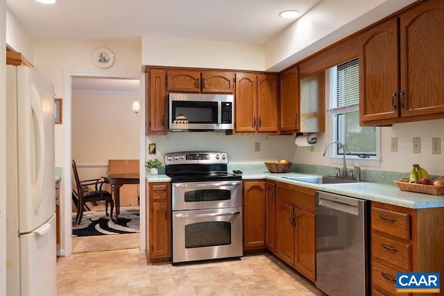 1754 Hearthglow Ln, Charlottesville, VA 22901 - kitchen with appliances with stainless steel finishes, light countertops, and brown cabinetry