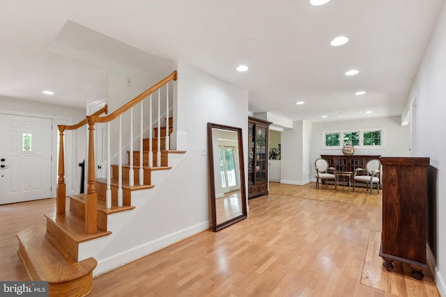 10418 Adel Rd, Oakton, VA 22124 - foyer entrance with light wood-style floors, stairway, and recessed lighting