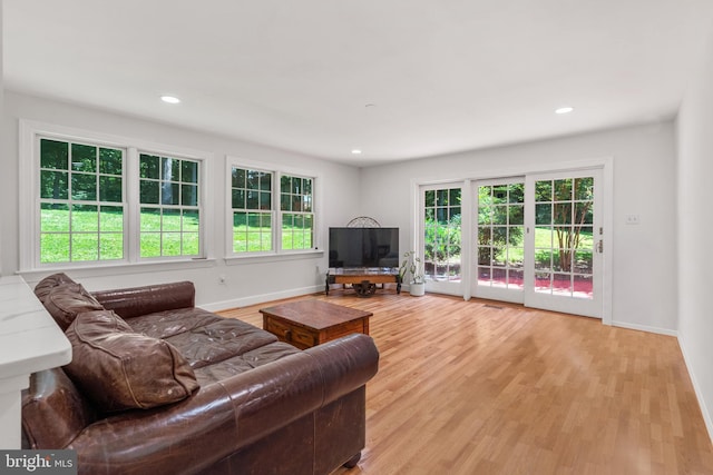10418 Adel Rd, Oakton, VA 22124 - living area with healthy amount of natural light, light wood finished floors, and recessed lighting