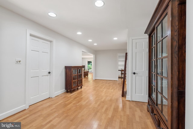 10418 Adel Rd, Oakton, VA 22124 - hallway with light wood-style flooring and recessed lighting