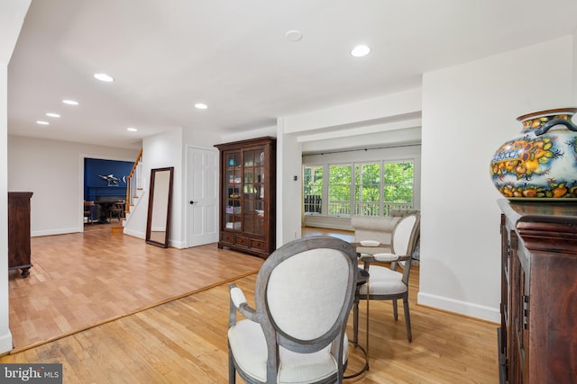 10418 Adel Rd, Oakton, VA 22124 - dining room featuring light wood-type flooring, recessed lighting, and stairway