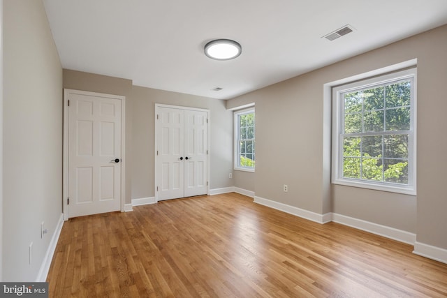 10418 Adel Rd, Oakton, VA 22124 - unfurnished bedroom featuring light wood-style flooring and a closet