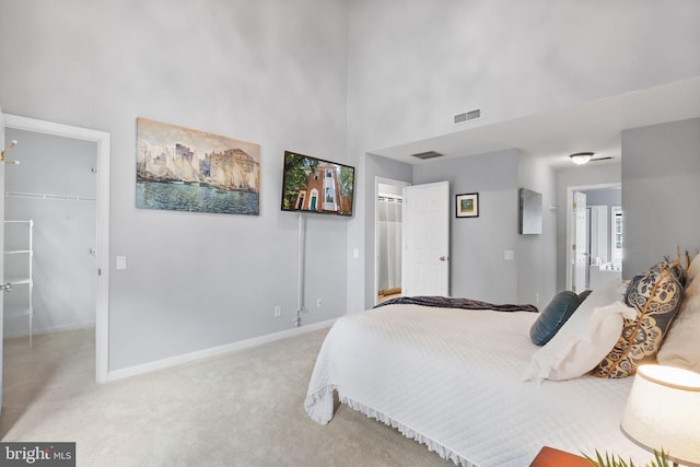 6038 Lincolnia Rd, Alexandria, VA 22312 - bedroom featuring a spacious closet, light carpet, a closet, and a high ceiling