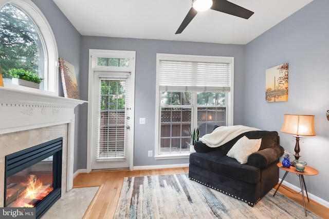 6038 Lincolnia Rd, Alexandria, VA 22312 - living area with a high end fireplace, wood finished floors, and a ceiling fan